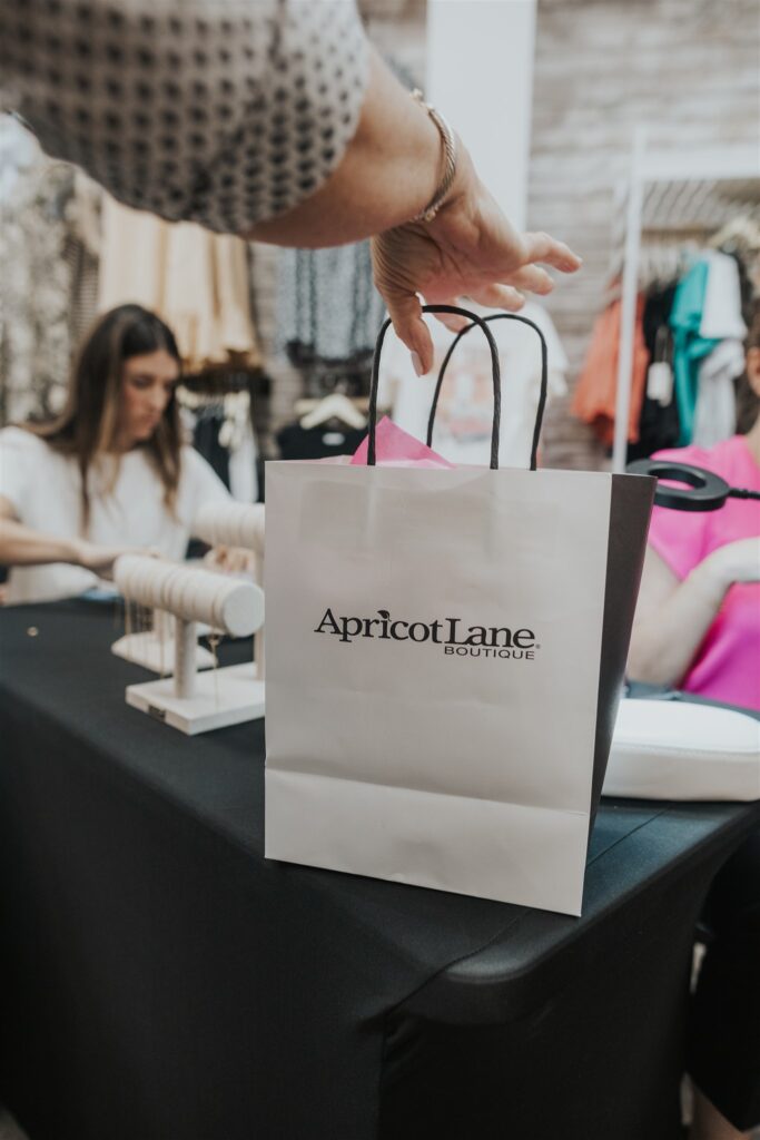 Permanent jewelry pop up at Apricot Lane Boutique in The Woodlands, TX
